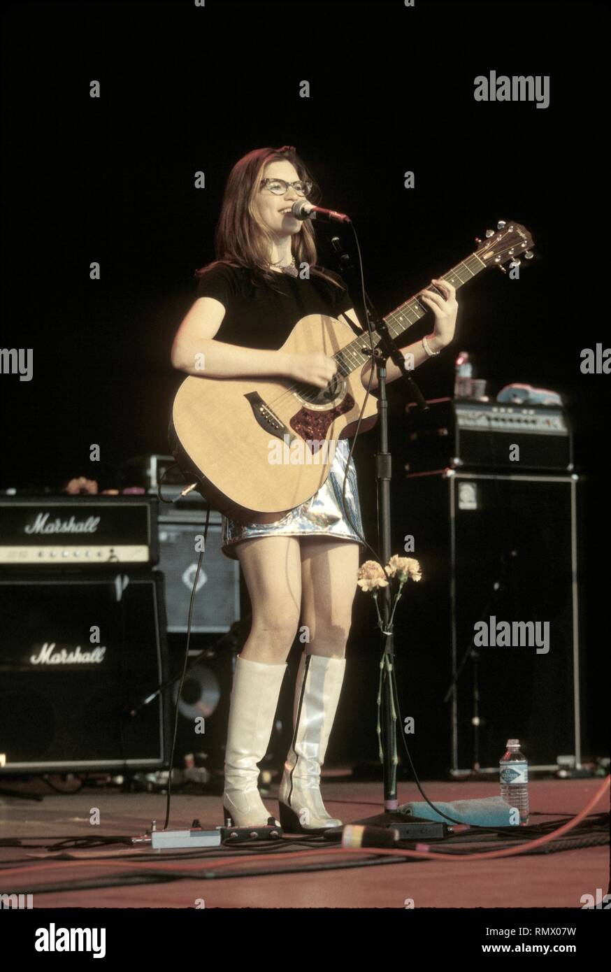 Singer, songwriter and actress Lisa Loeb is shown performing on stage during a 'live' concert appearance. Stock Photo