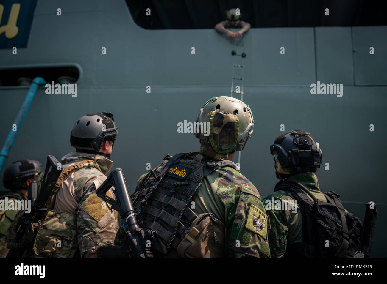 U.S. Navy SEALS with SEAL Team 5 and Royal Thai Navy SEALs conduct visit, board, search and seizure training during exercise Cobra Gold in Sattahip, Kingdom of Thailand, Feb. 15, 2019. Cobra Gold 19 provides a venue for the United States and partner nations to advance interoperability and increase partner capacity in planning and executing complex and realistic multinational force and combined task force operations. (U.S. Marine Corps photo by Staff Sgt. Matthew J. Bragg) Stock Photo