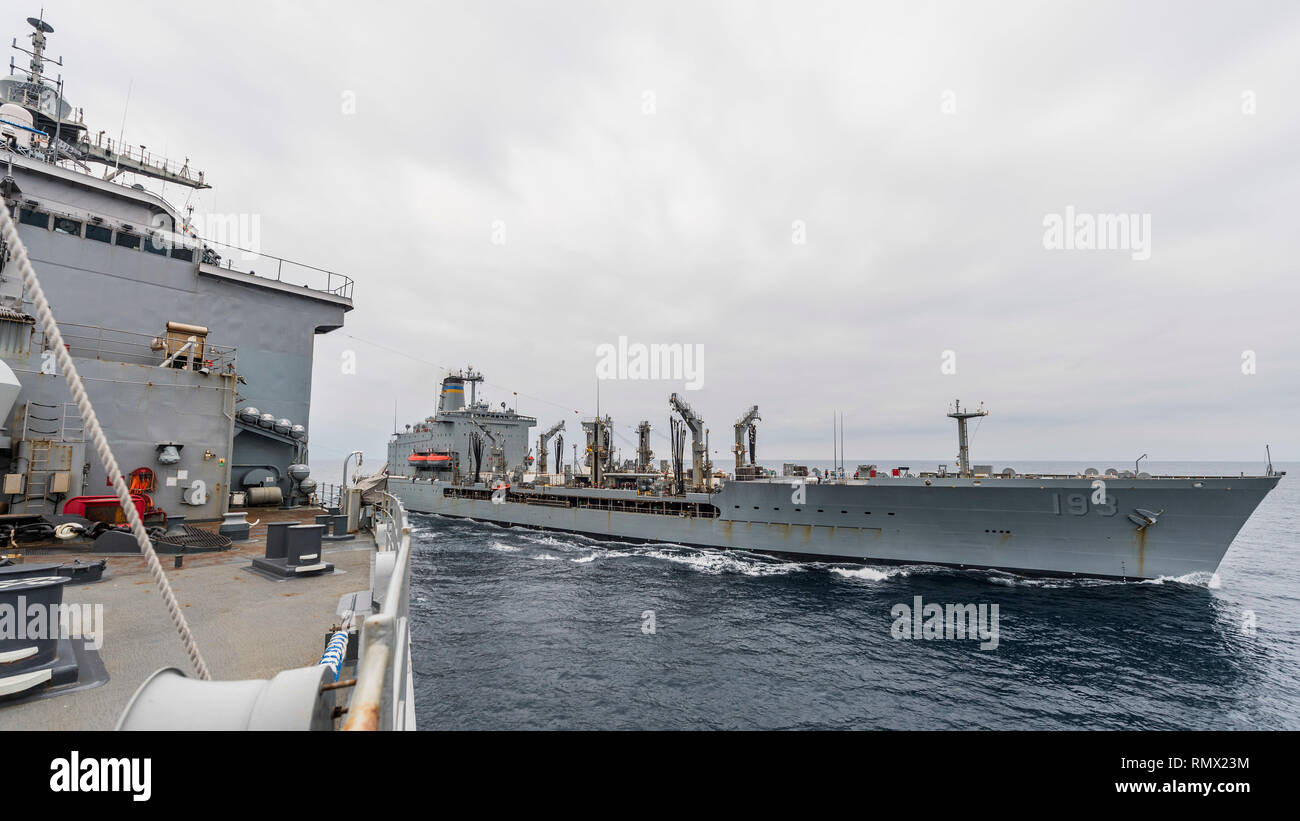 190215-N-WI365-1067 EAST CHINA SEA (Feb. 15, 2019) – The amphibious dock landing ship USS Ashland (LSD 48) prepares to conduct a replenishment-at-sea (RAS) with the fleet replenishment oiler USNS Walter S. Diehl (T-AO 193). Ashland, part of the Wasp Amphibious Ready Group, with embarked 31st Marine Expeditionary Unit, is operating in the Indo-Pacific region to enhance interoperability with partners and serve as a ready-response force for any type of contingency. (U.S. Navy photo by Mass Communication Specialist 2nd Class Markus Castaneda) Stock Photo