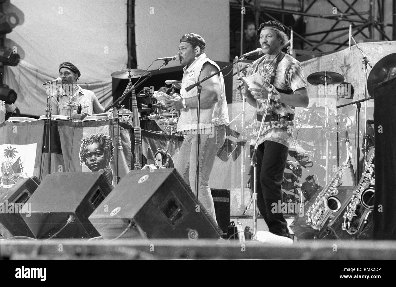 Band members of the Neville Brothers are shown performing on stage at
