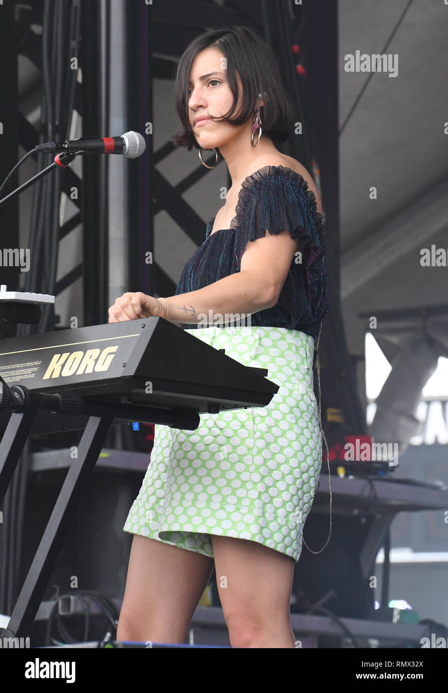 Musician Kai Campos is shown performing on stage during a “live