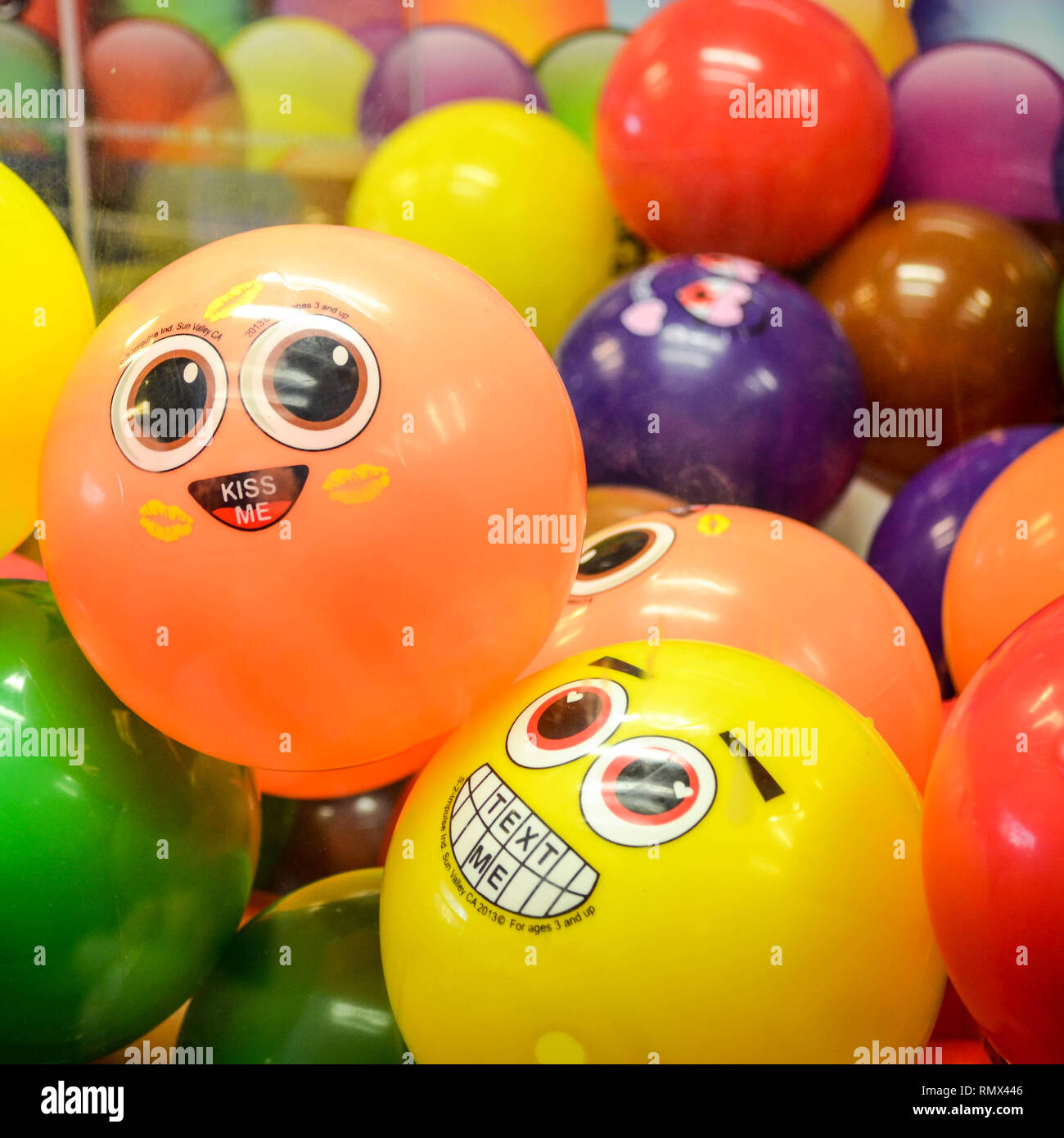 Emoji toy balls with texting messages in a vending machine in