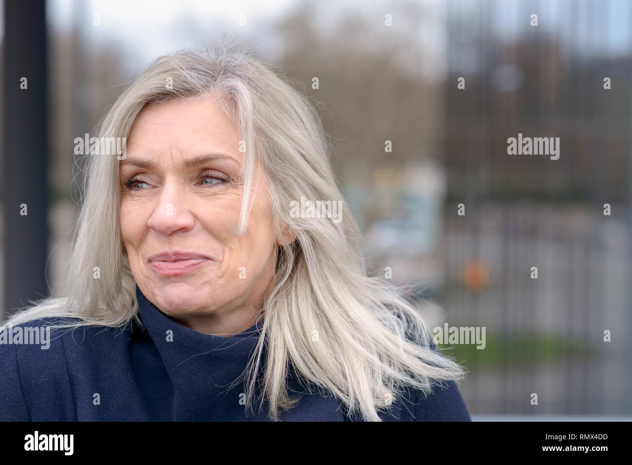 Attractive Mature Woman With Tousled Shoulder Length Blond Hair