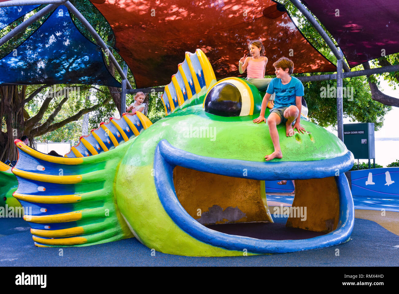 Children playing in the playground of a Public Park, Cairns, Australia Stock Photo