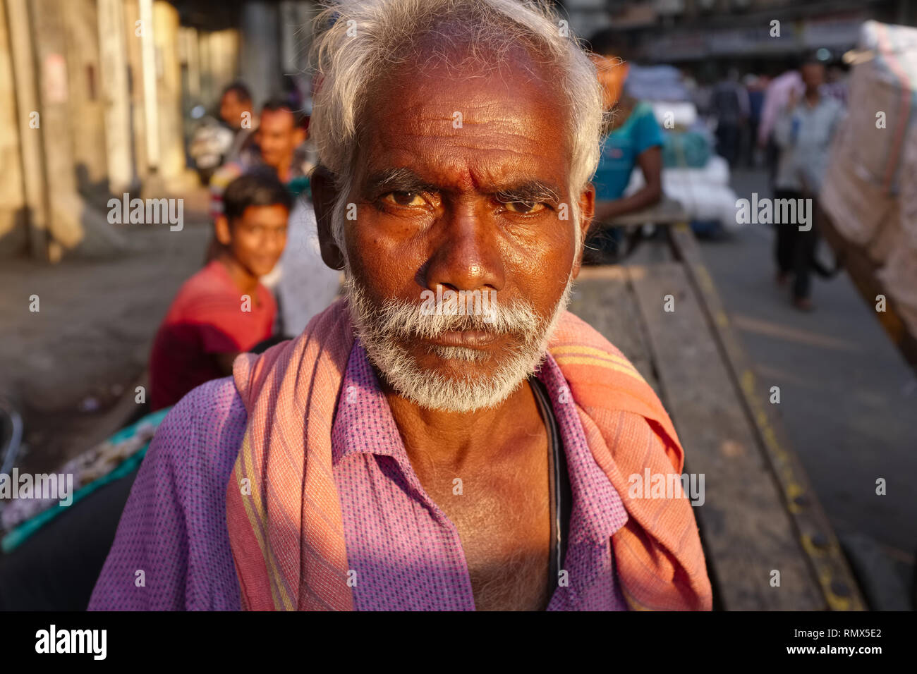 Portrait of a handcart puller, a migrant from Tamil Nadu in Southern India,  seen in Kalbadevi Road, Mumbai, India Stock Photo