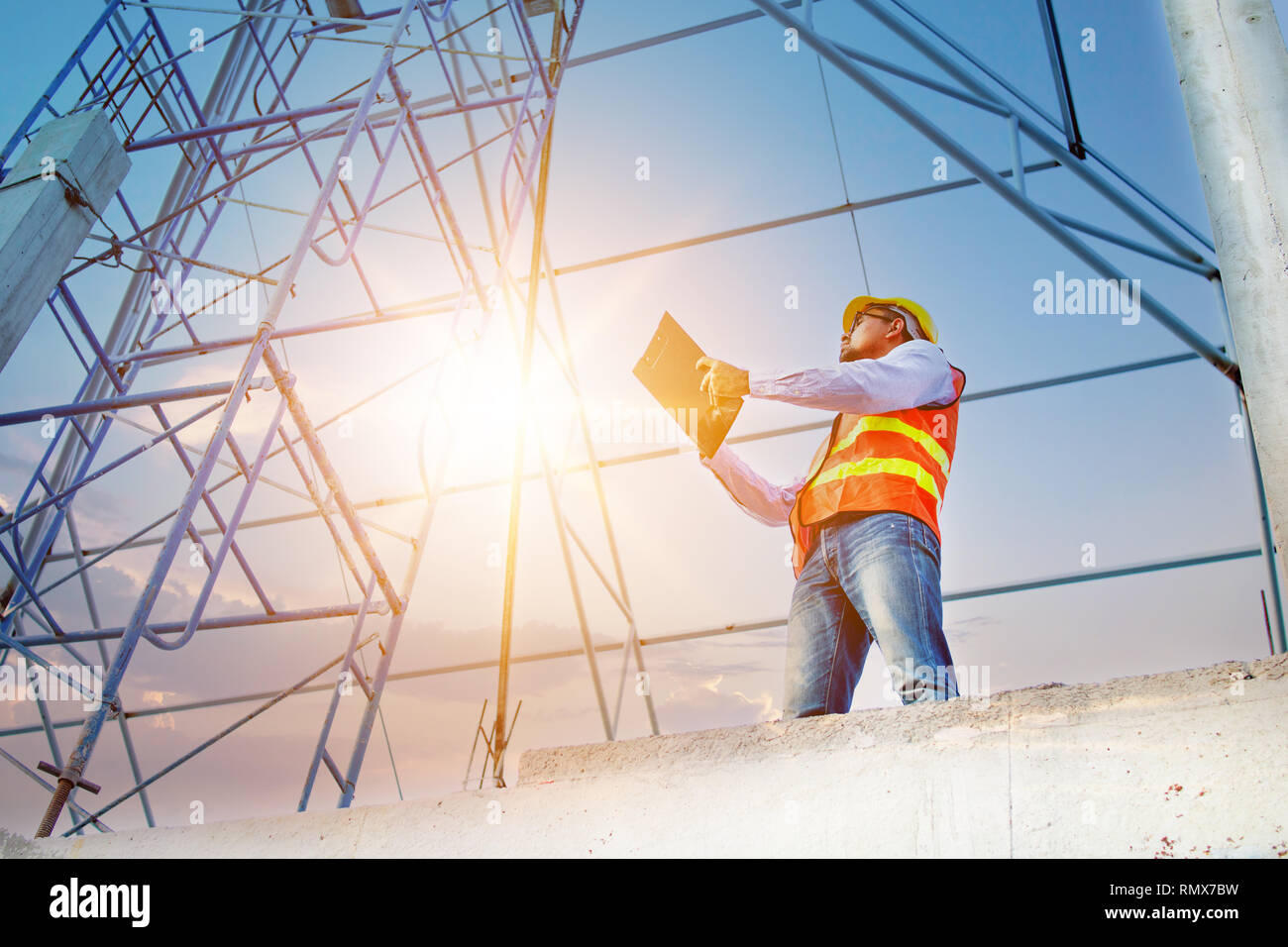 Engineer or inspector checking progressing work in construction site Stock Photo