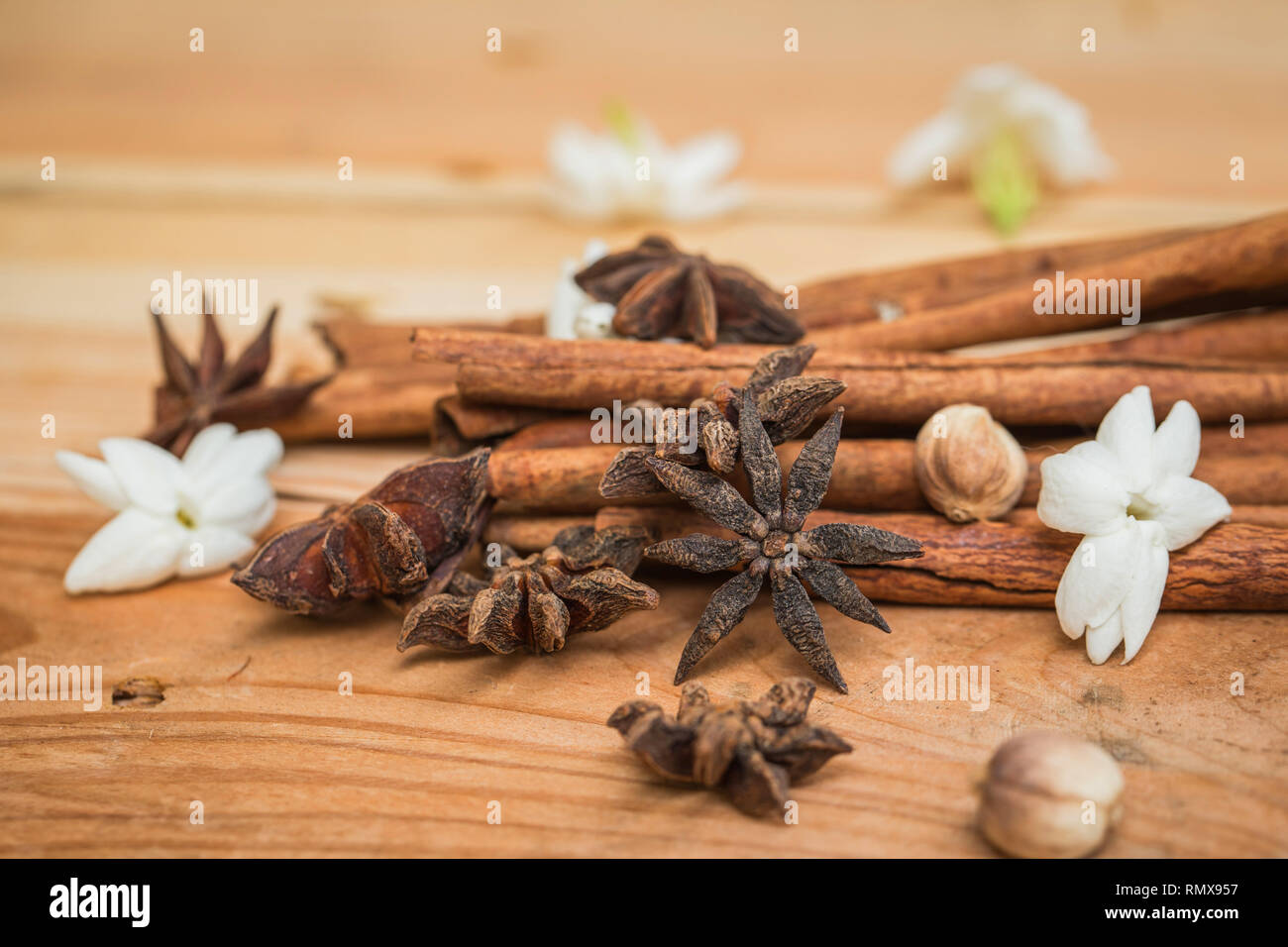 wood herbal anise stars with cinnamon on rustic wooden table. Stock Photo