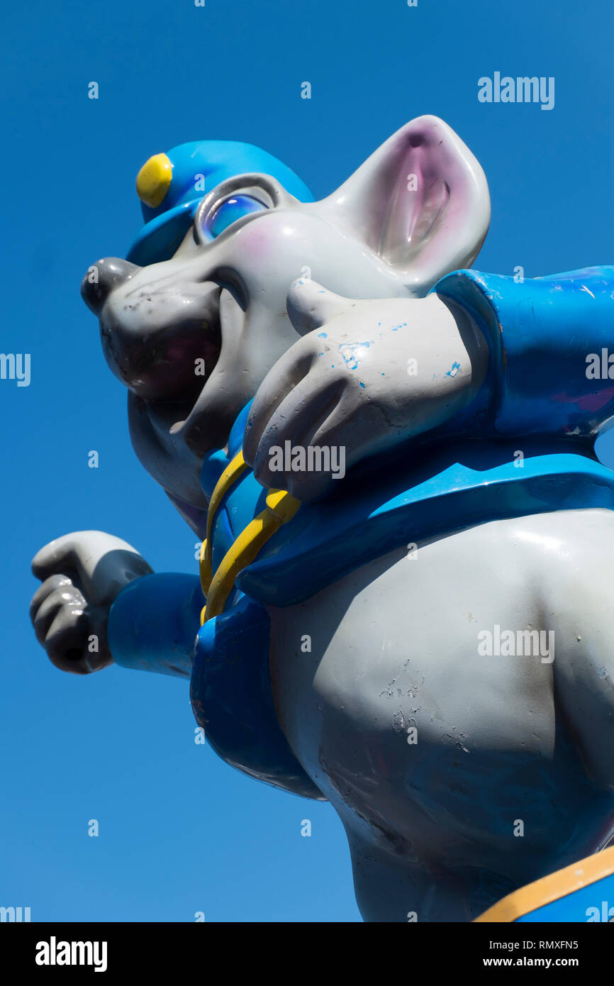 Low angle look at a fiberglass amusement park mouse in California. Stock Photo