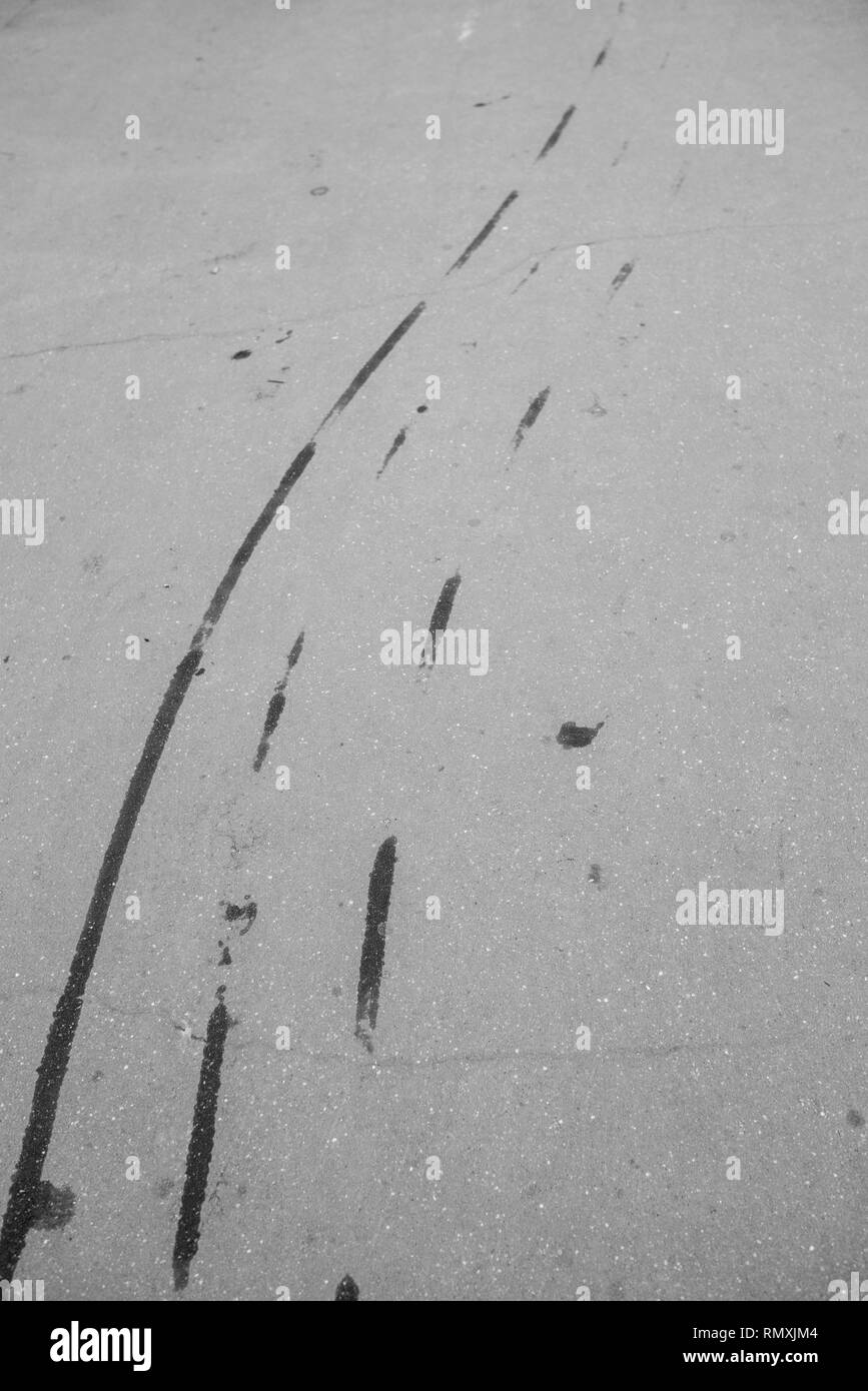 Aerial top view background with skid tire marks on race track. Stock Photo