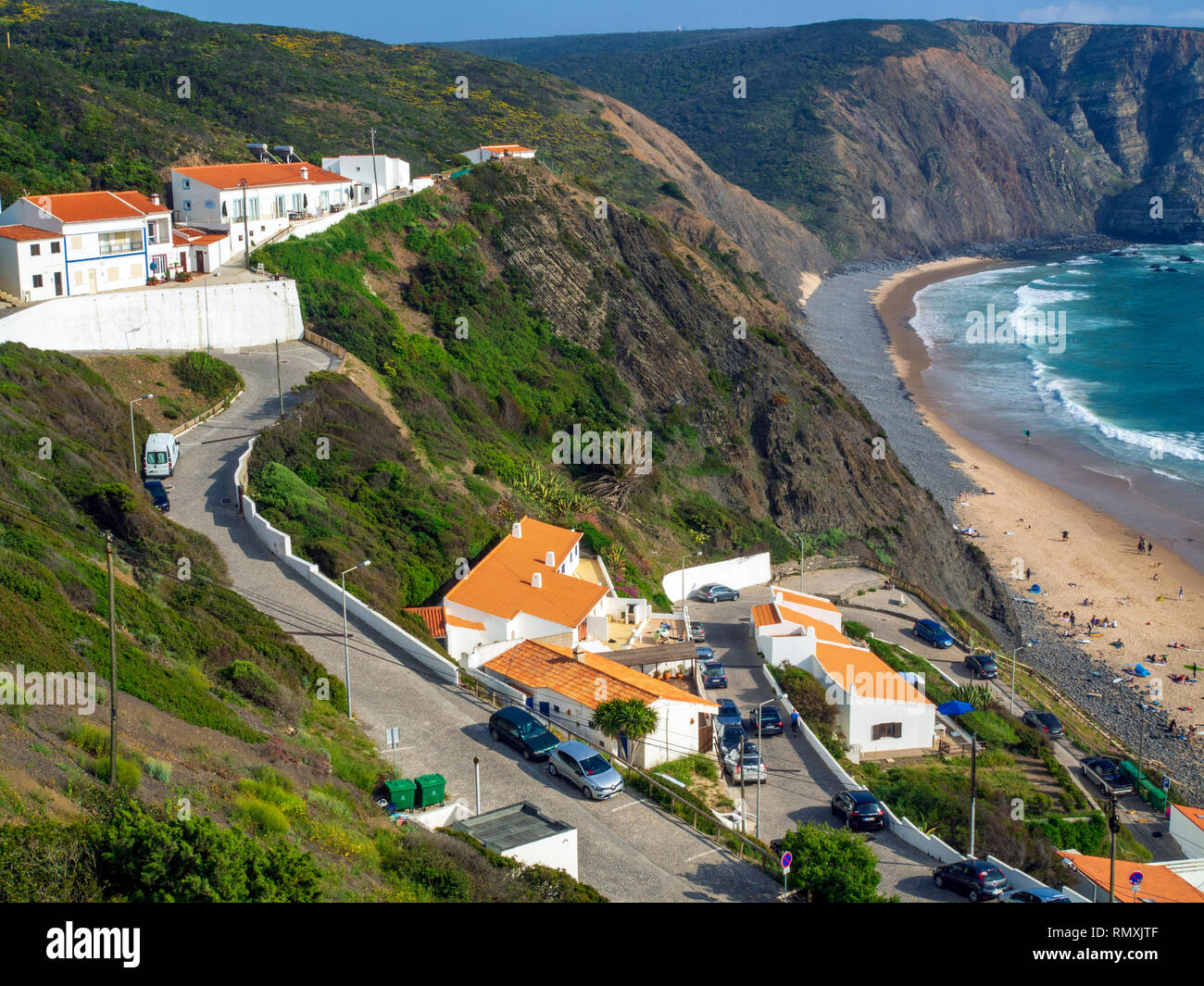 View over the beach in Arrifana, a small village popular with surfers on Portugal's south western coastline. Stock Photo