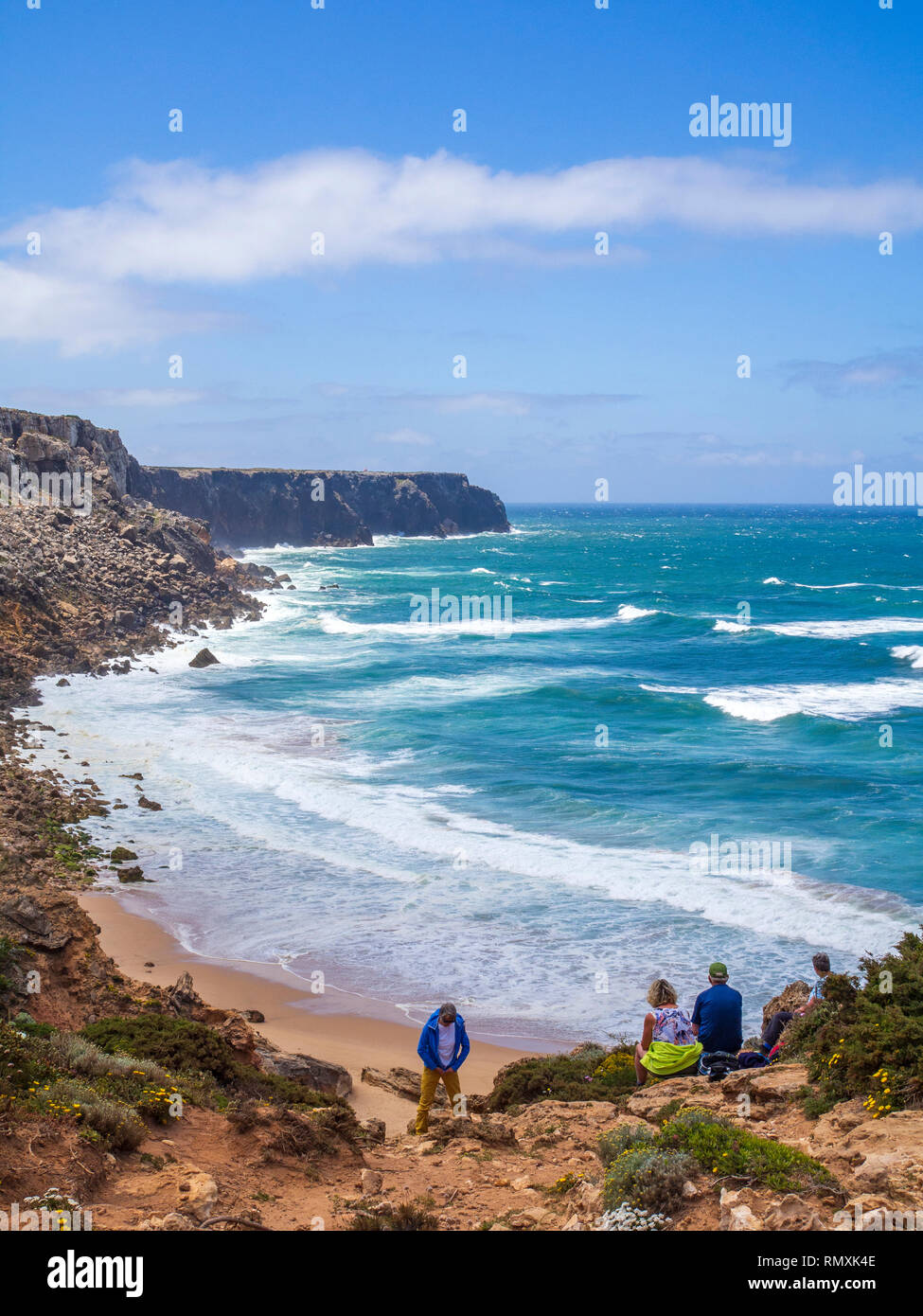 Trekkers enjoying a view of the coastline towards Cape St. Vincent, Portugal's most south westerly point, in the Algarve region. The area is part of t Stock Photo