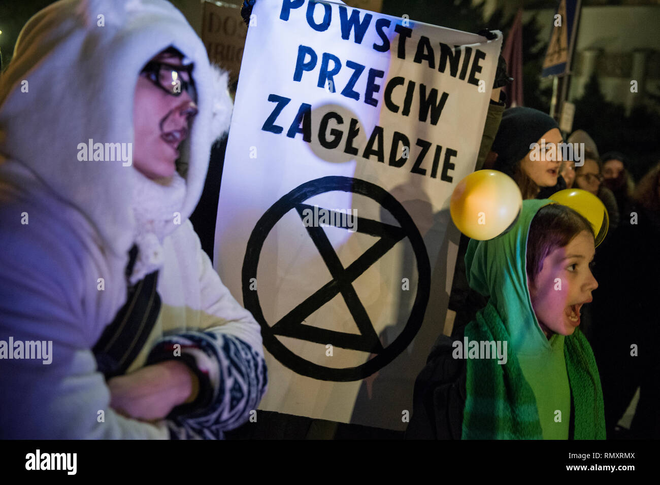 Protesters are seen shouting slogans while holding a banner with the Extinction Rebellion symbol during the first ever Earth Strike in Warsaw and all around the country. In Warsaw hundreds of people protested outside the parliament. It is an initiative of the Earth Strike movement, which aims to protect our planet from disaster. Today's protest was the first out of four planned, the next are scheduled for April, August and September. The purpose of the events is to increase awareness of the impending climate disaster and to exert pressure on politicians and corporations that continue to ignore Stock Photo