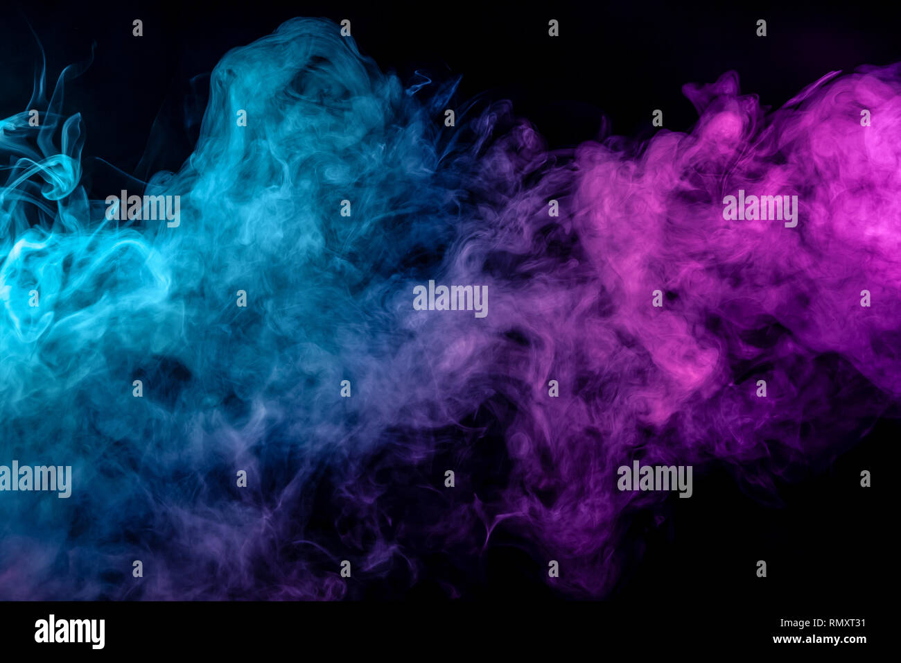 Fog colored with bright pink and blue smoke on dark background Stock ...