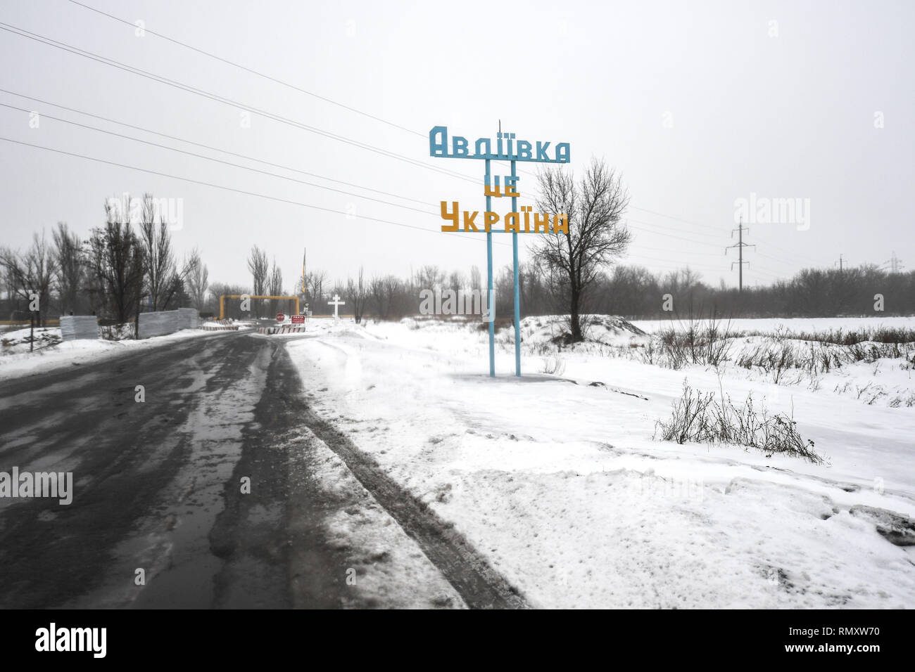 The sign for Advika is seen in Ukrainian colors. The town has exchanged hands many times and experienced some of the worst fighting over the years. The conflict in the Eastern Ukraine has become more political than physical since 2014 when 12,000 lost their lives. Today though, it is spasmodic and most shelling is during the nighttime. (The official observers from OSCE organization do not monitor at night!). Due to the Minsk ceasefire both parties try to respect it and only light equipment is seen in use. Stock Photo