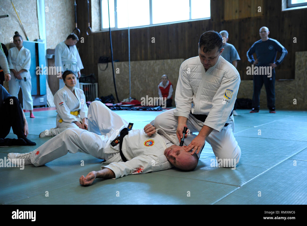 Nippon kempo instructor teaching of self protection using improvised