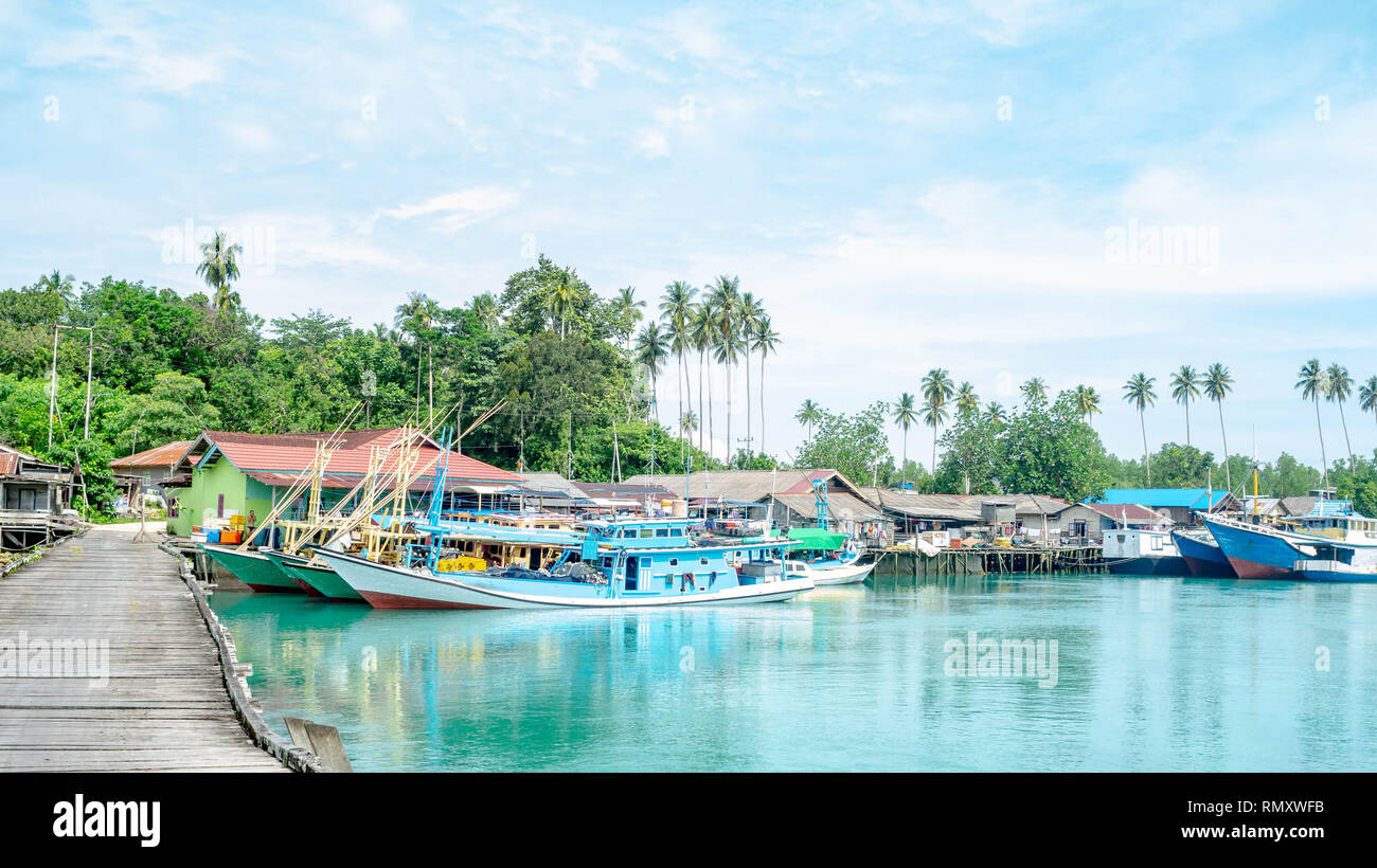 traditional fisherman's boat docked in the harbor, Labuhan cermin, Berau, Indonesia.. Labuhan Cermin is one of tourist resort in Indonesia Stock Photo