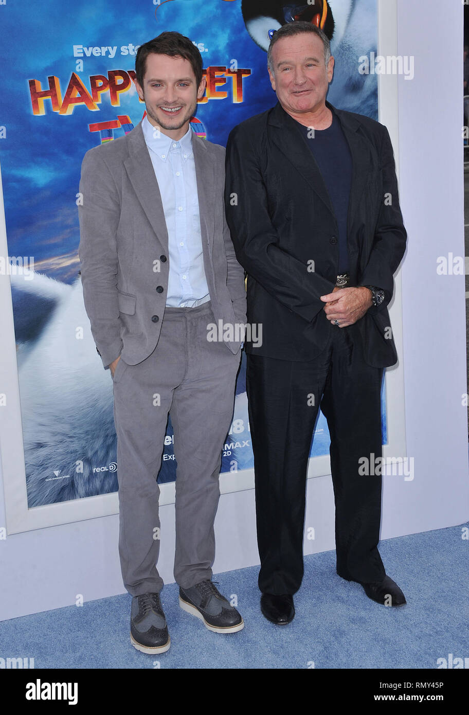 Actors Elijah Wood and Robin Williams at the Los Angeles premiere