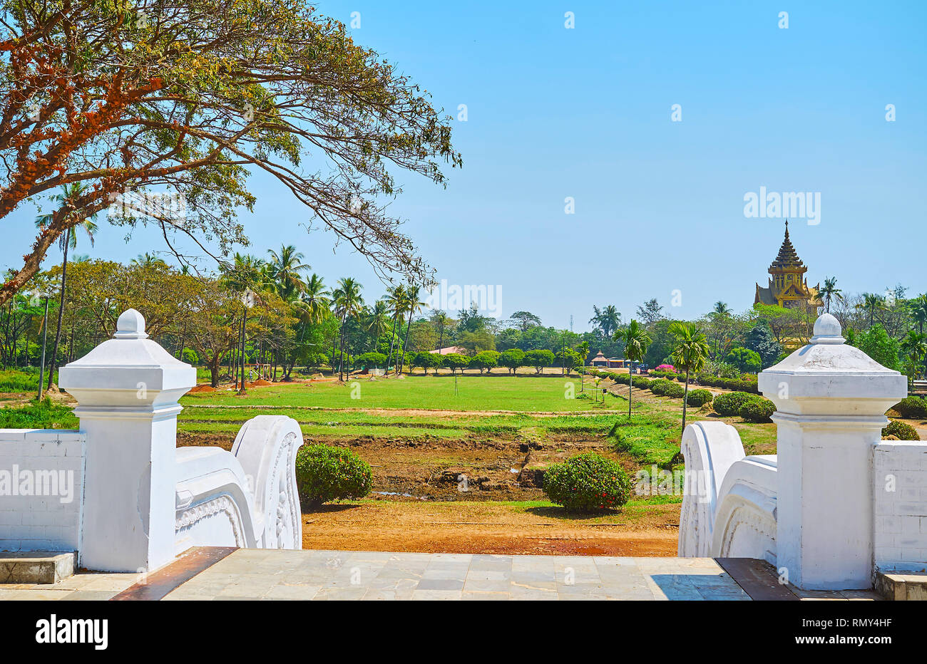 The picturesque garden in front of restored Kanbawzathadi palace with a view on Bhammayarthana Throne Hall (Bee Hall) on the background, Bago (Pegu),  Stock Photo
