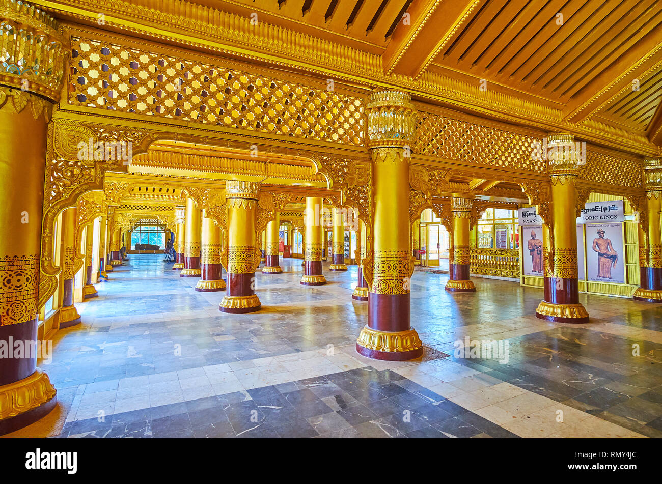 BAGO, MYANMAR - FEBRUARY 15, 2018: Lion Throne Hall of Kanbawzathadi palace with gilded columns, decorated with carvings, painted patterns and fine mi Stock Photo