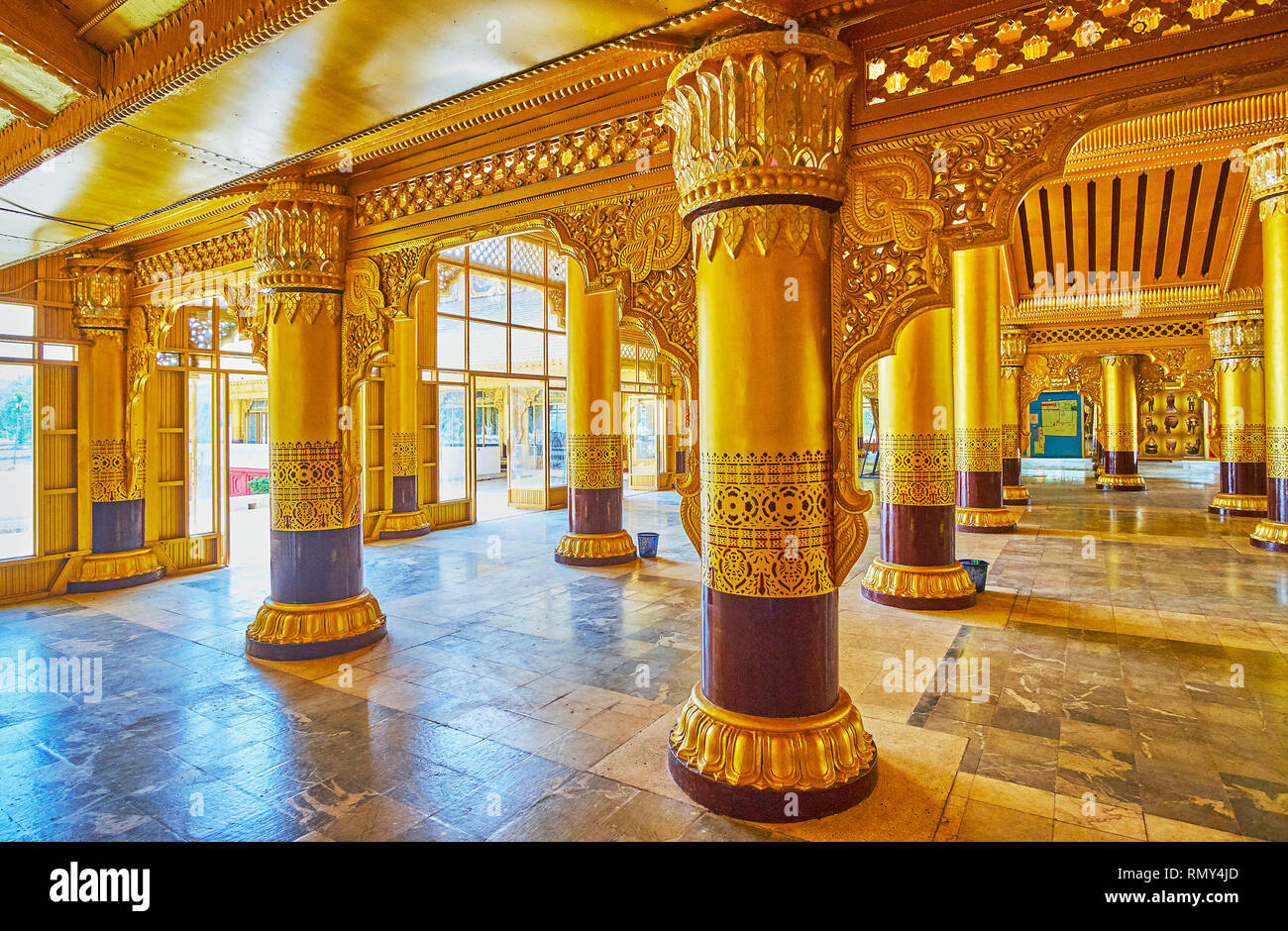 BAGO, MYANMAR - FEBRUARY 15, 2018: Walk among the ornate columns of Lion Throne Hall (Great Audience Hall) of historic royal Kanbawzathadi Golden pala Stock Photo