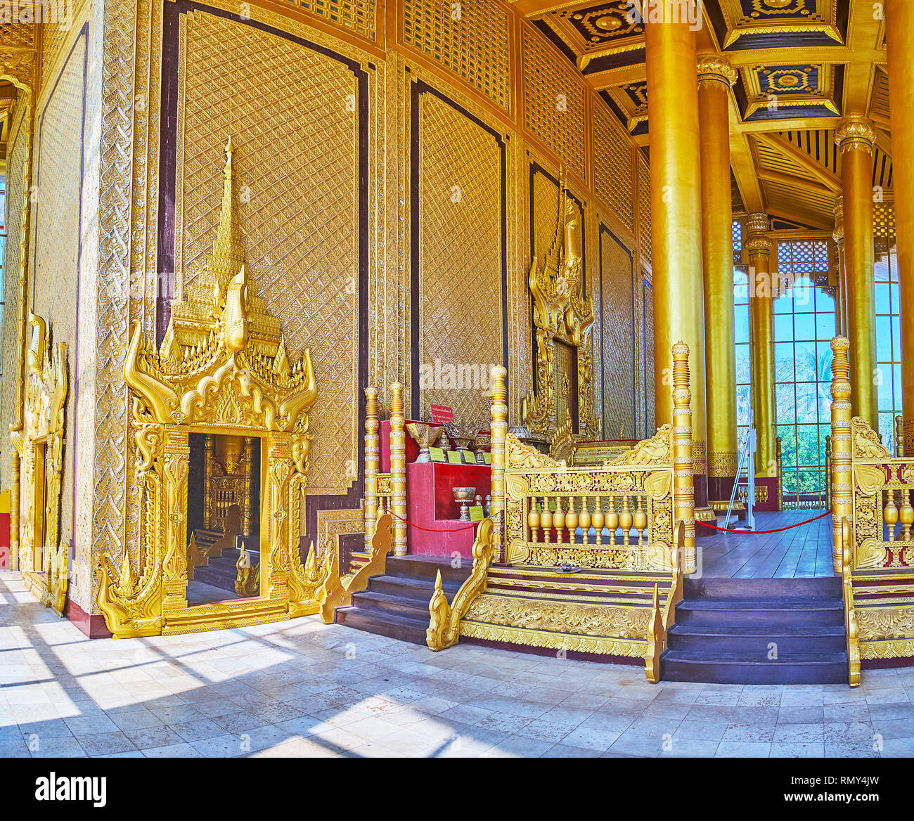BAGO, MYANMAR - FEBRUARY 15, 2018: The Great Audience Hall of Kanbawzathadi Golden palace is famous for rich ornaments of carved wood, tall columns an Stock Photo