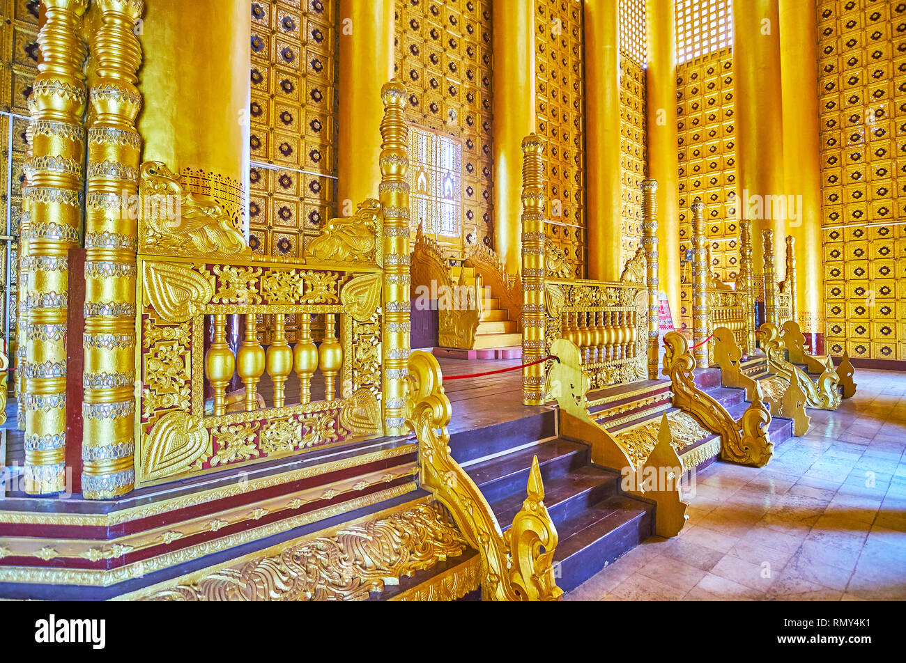 BAGO, MYANMAR - FEBRUARY 15, 2018: The Lion (Thihathana) Throne Hall of Kanbawzathadi Golden palace is decorated with intricate carved patterns, mirro Stock Photo