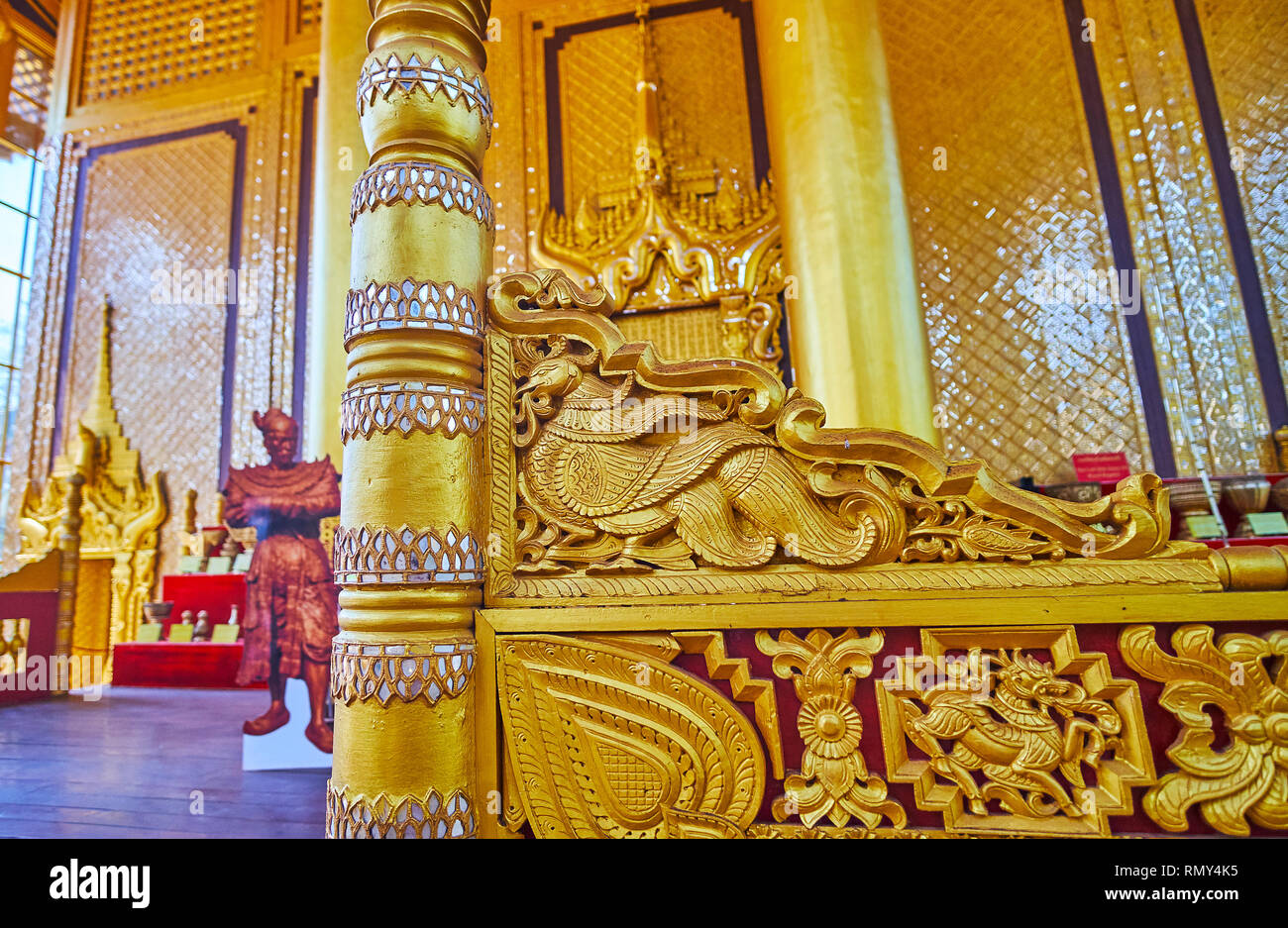BAGO, MYANMAR - FEBRUARY 15, 2018: The carved decors of Lion (Thihathana) Throne Hall in Kanbawzathadi Golden palace with mirror elements and gilding, Stock Photo