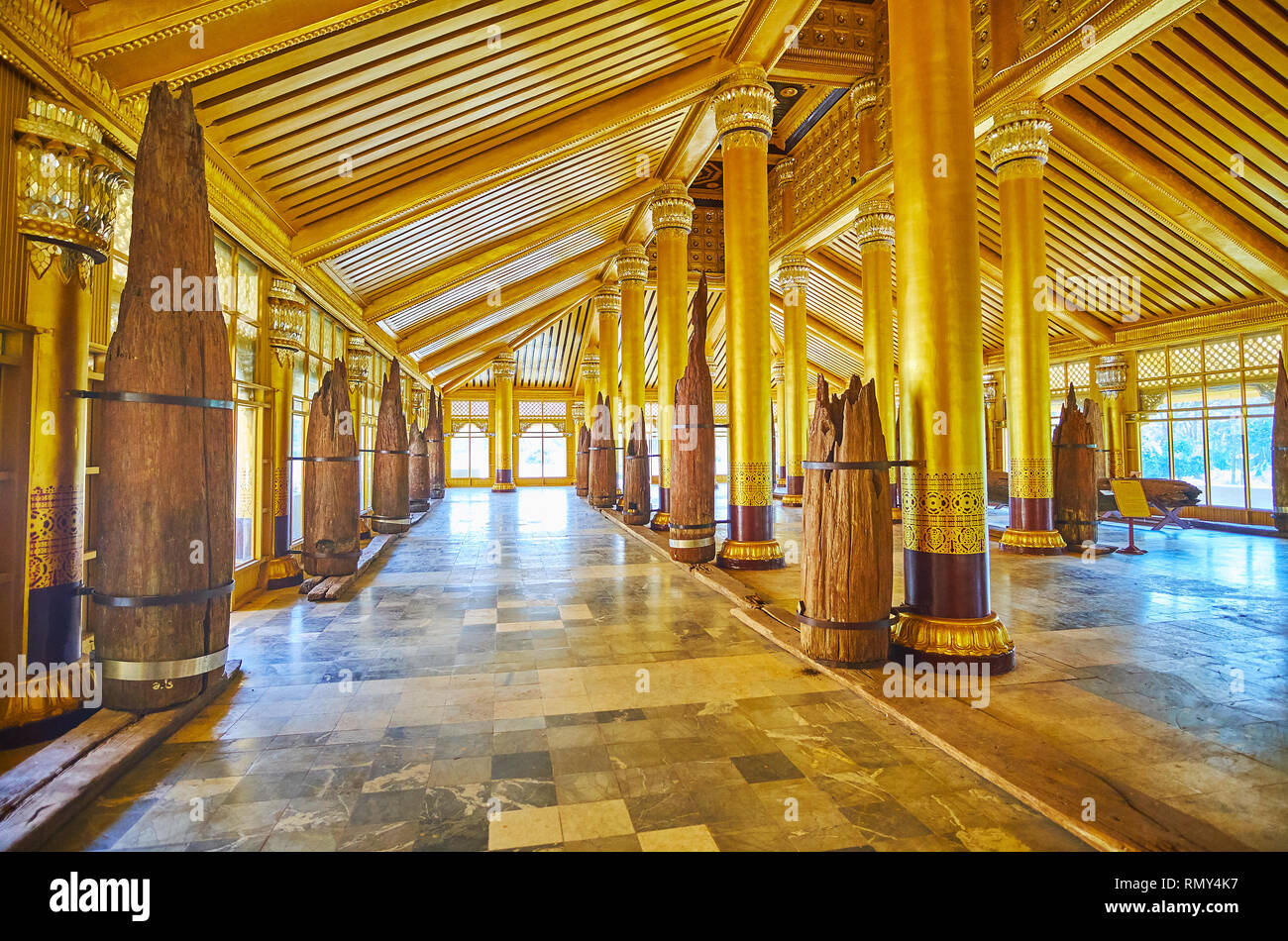 BAGO, MYANMAR - FEBRUARY 15, 2018: The ruins of the medieval teak wood pillars in Lion (Thihathana) Throne Hall of Kanbawzathadi Golden palace, on Feb Stock Photo
