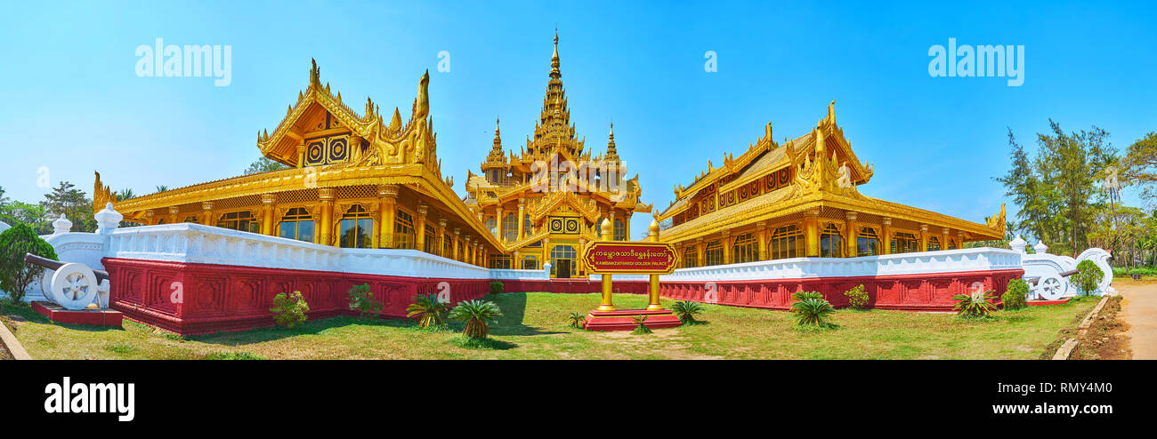 Panorama of exterior of Kanbawzathadi golden palace with gilded wooden pyatthat roof, scenic carvings and large windows, Bago, Myanmar. Stock Photo