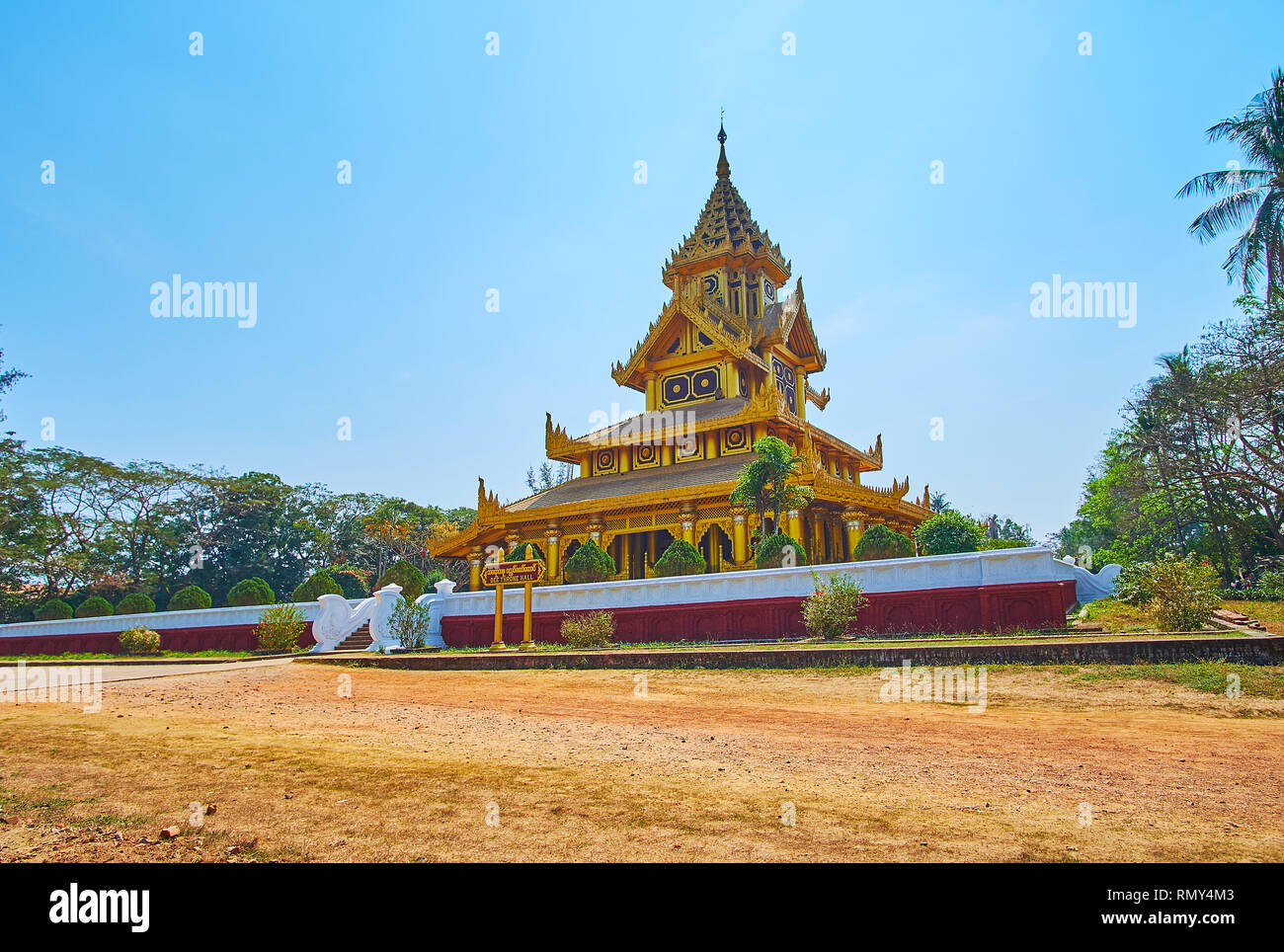 The scenic Bee (Bhammayarthana) Throne Hall of Kanbawzathadi palace with ornate carved decors and traditional Burmese pyatthat roof, Bago, Myanmar. Stock Photo