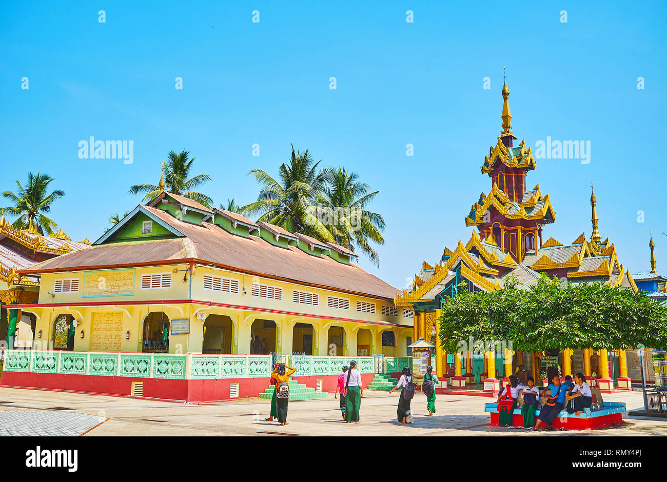 BAGO, MYANMAR - FEBRUARY 15, 2018: Image houses of Shwemawdaw Paya include the ordinary brick buildings and traditional Burmese shrines with pyatthat Stock Photo
