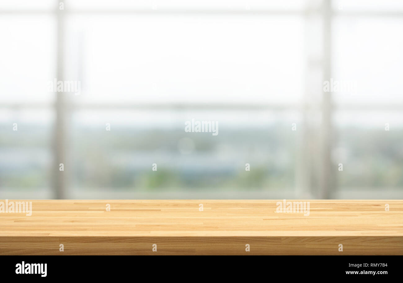 Wood table top on blur window glass, restaurant wall  montage  product display or design key visual layout background Stock Photo - Alamy