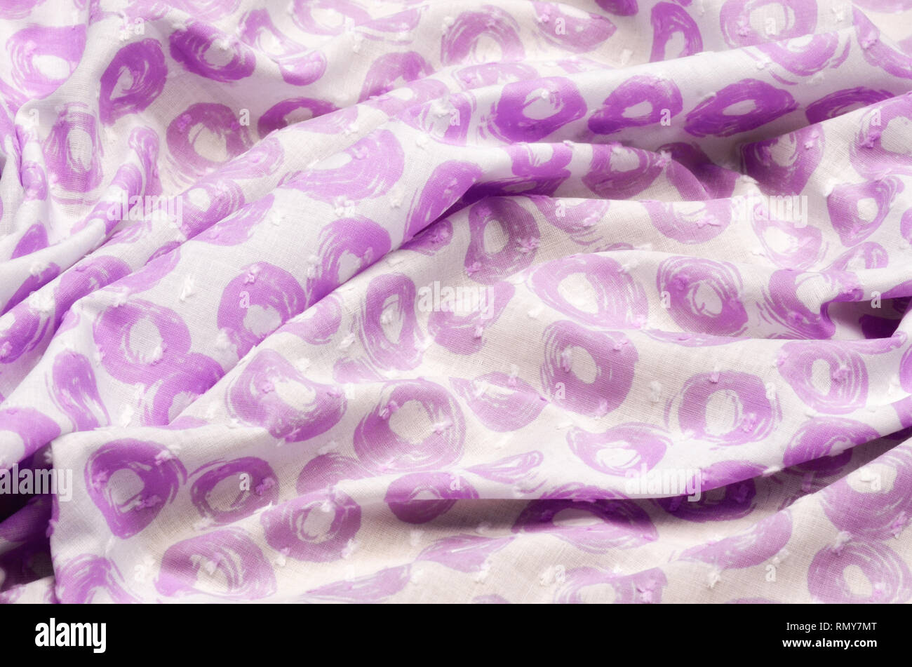 Cloth cotton, cambric in lilac polka dots on white Stock Photo
