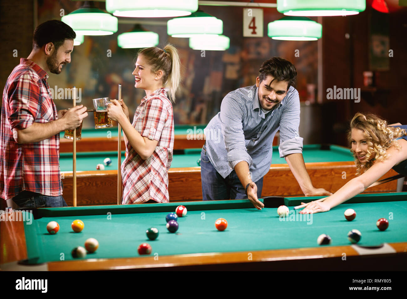 billiard friends- enjoying in beer and playing snooker in bar Stock Photo