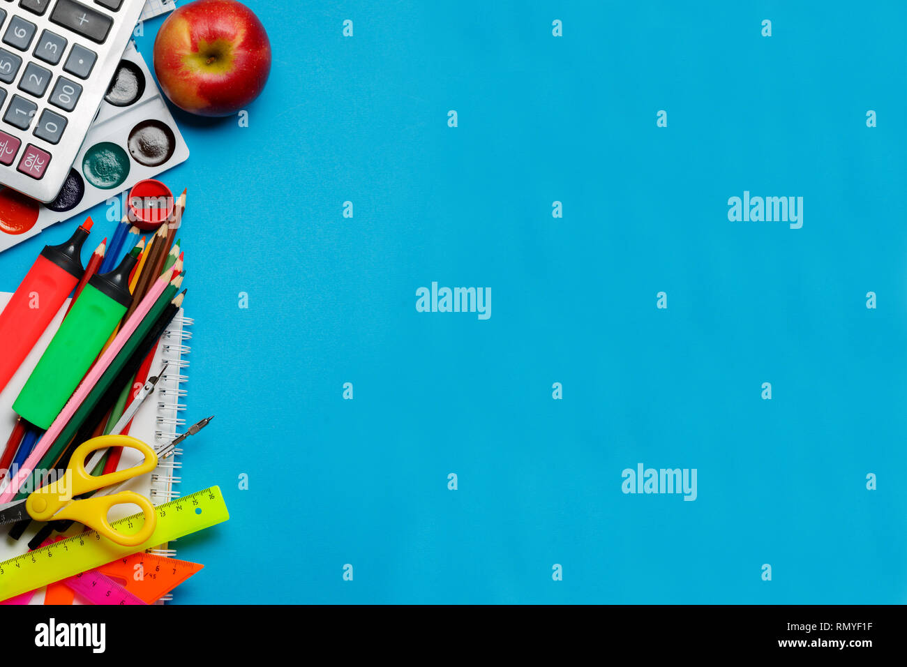 School supplies on blue background Stock Photo - Alamy