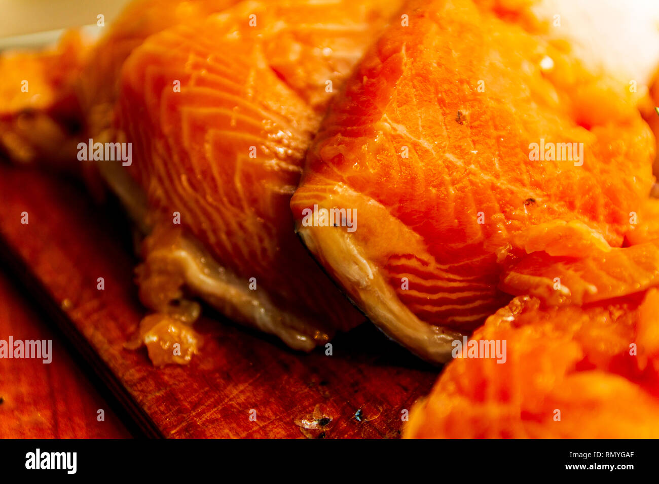 Salmon cuts on a cutting board isolated rustic Stock Photo