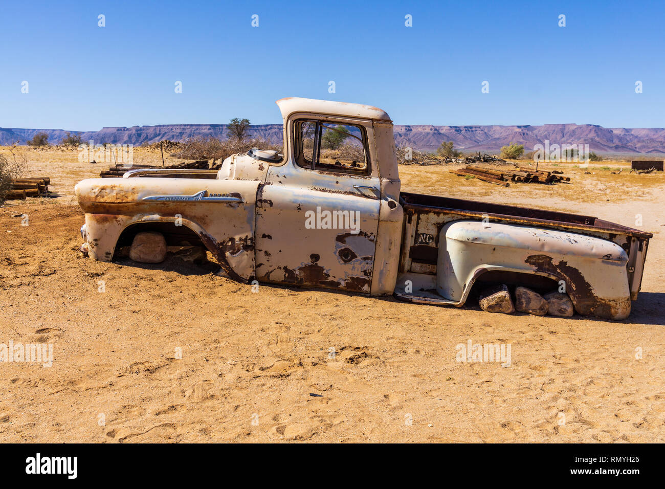 KARAS REGION, NAMIBIA - JULY 26, 2018: Old rusted car in the desert of Namibia at summer Stock Photo