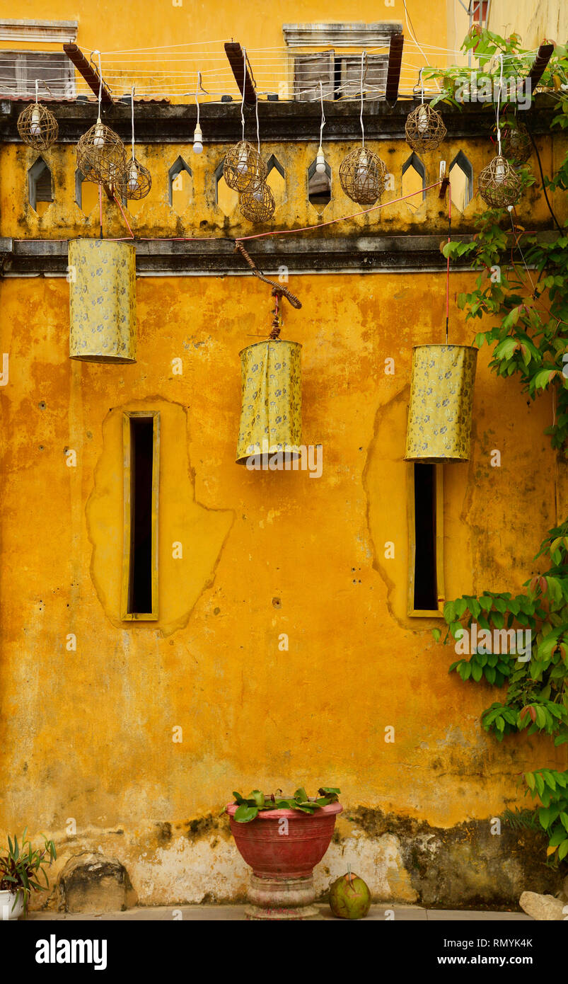 A yellow wall on an old historic building in the UNESCO listed central