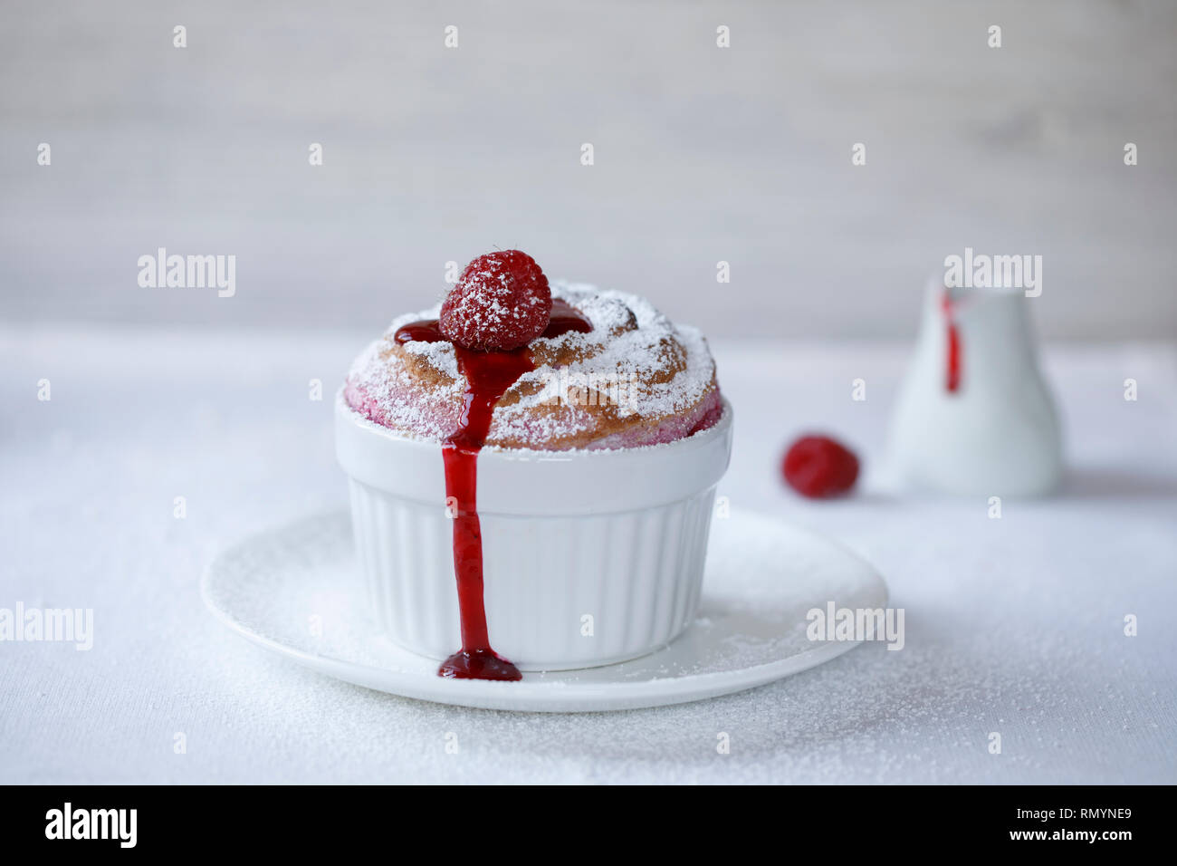 Raspberry souffle with sauce Stock Photo Alamy
