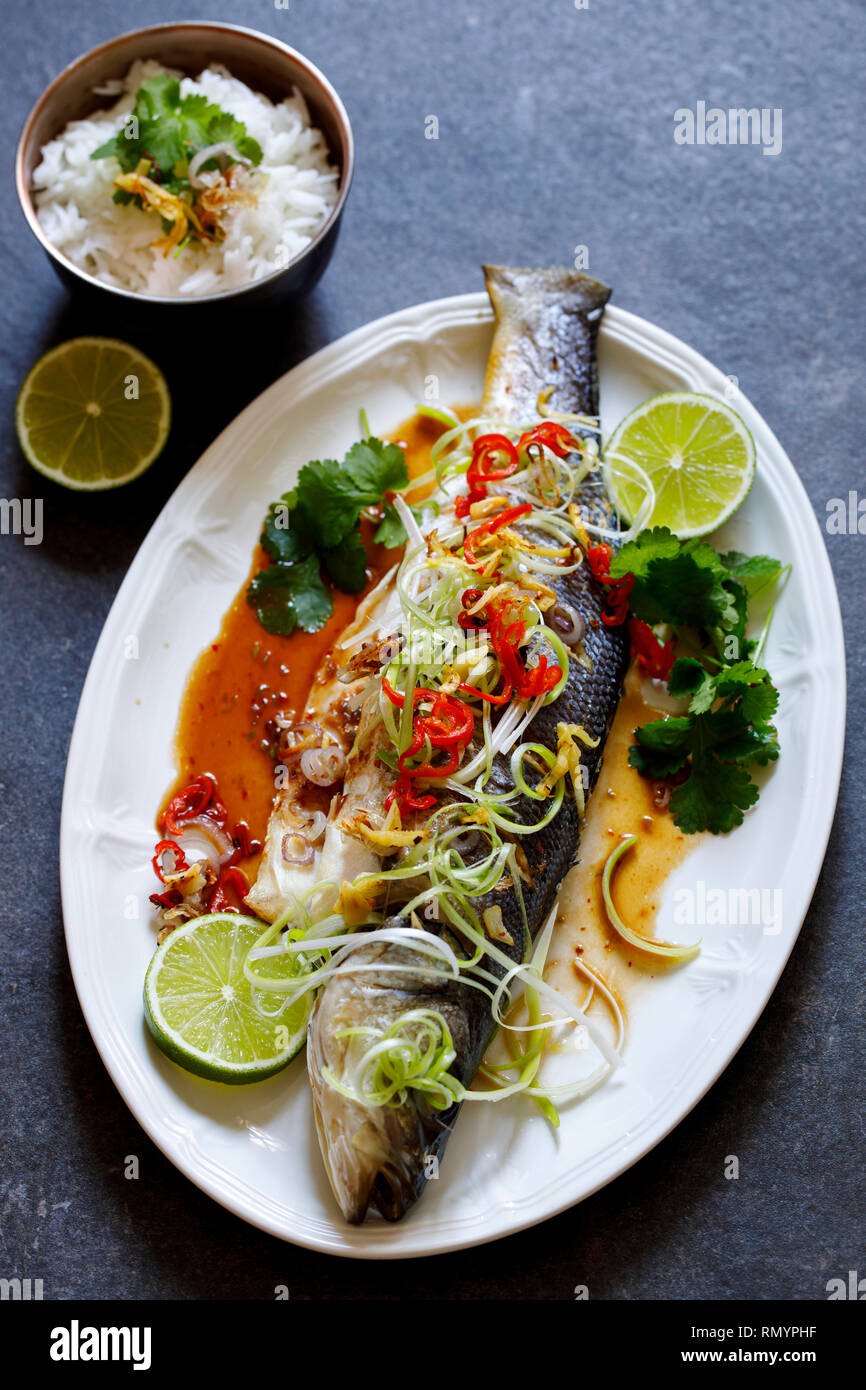 Whole sea bass baked with Thai spices Stock Photo - Alamy