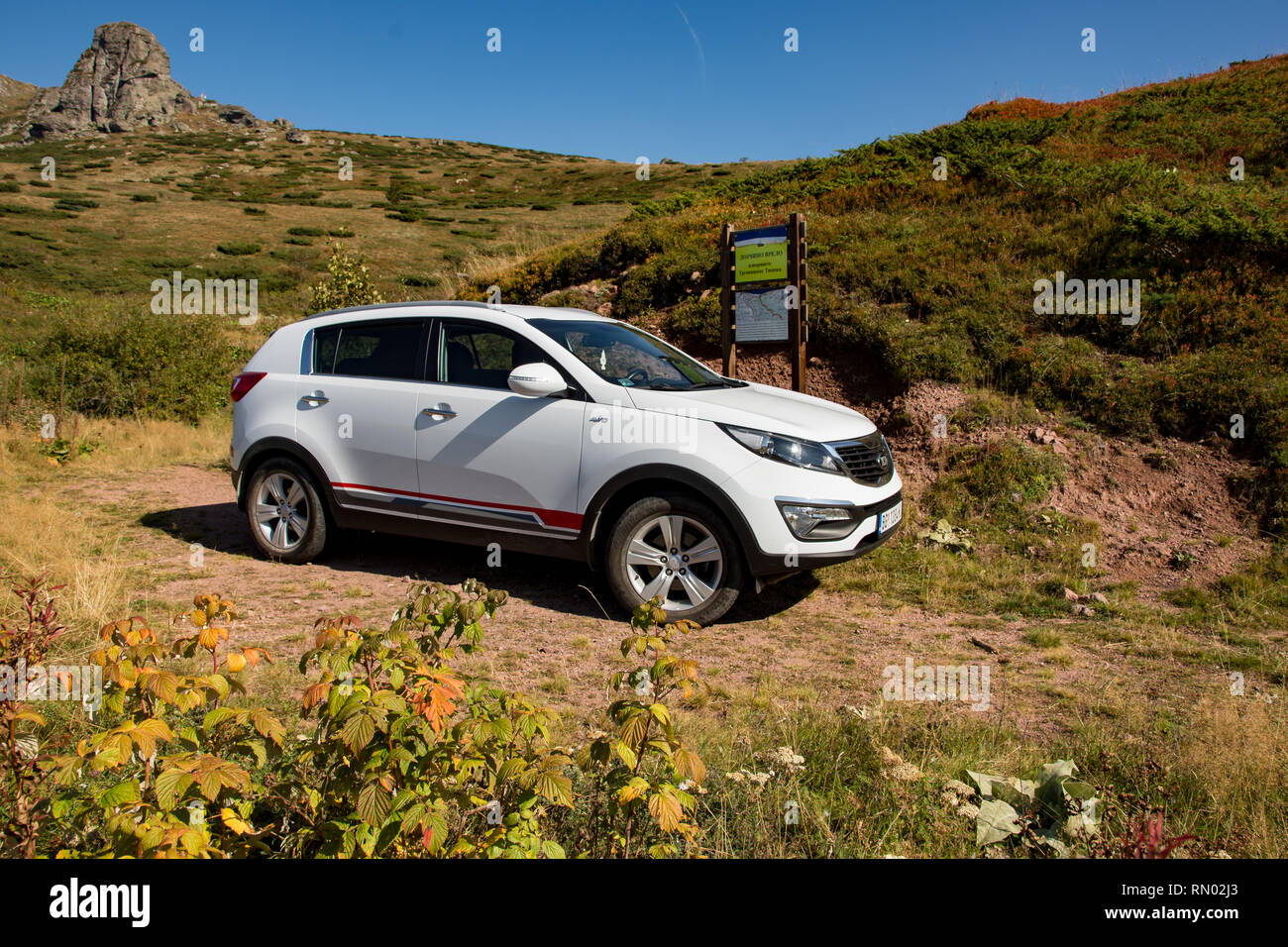 Car Kia Sportage 2 0 Crdi Awd Or 4x4 White Color Near The Road In Forest Stock Photo Alamy