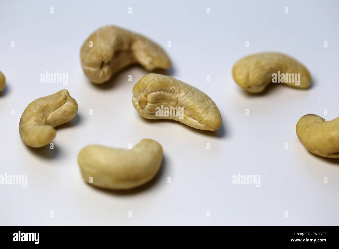Natural, organic cashew nuts in a closeup photo. Photographed on top of