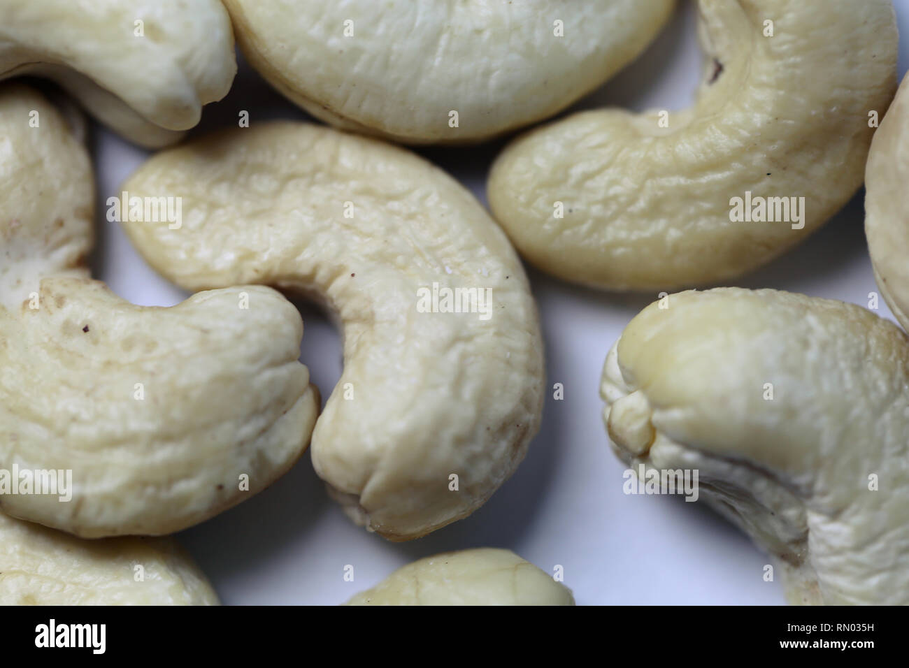 Natural, organic cashew nuts in a closeup photo. Photographed on top of