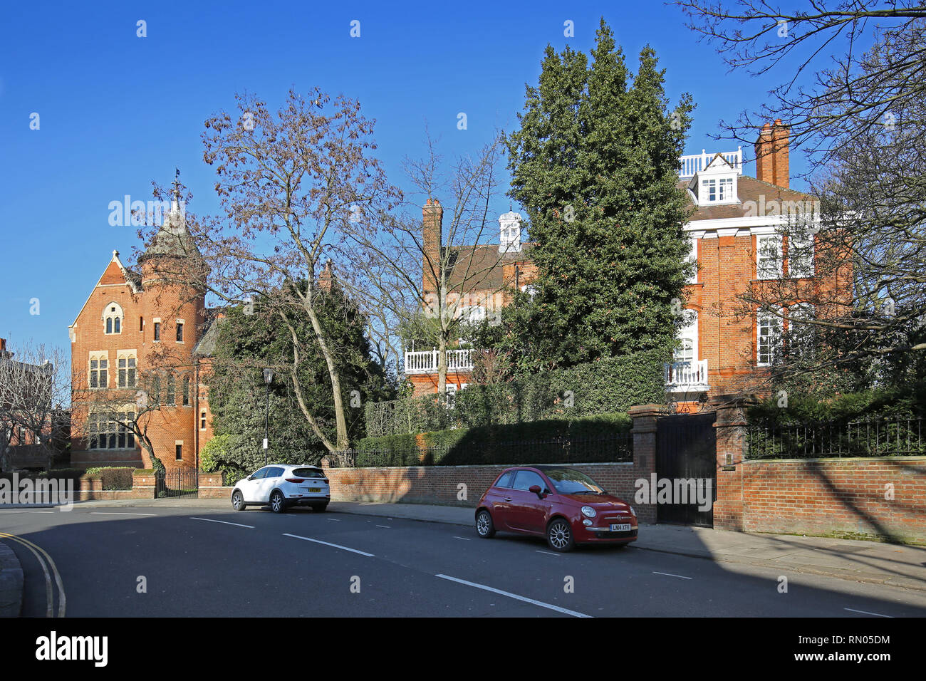Kensington, London: The Tower House (left), owned by Led Zeplin's Jimmy Page, next door to Robbie Williams' house (right). The two are in dispute. Stock Photo