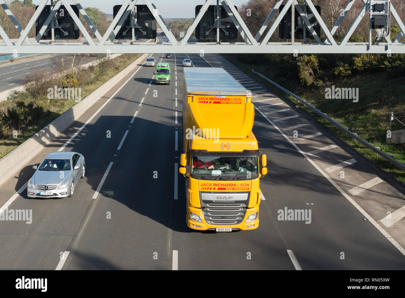 Traffic on the four lane M3 smart motorway near Lightwater in Surrey, UK Stock Photo