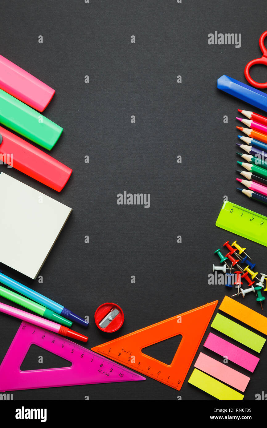 Back to school supplies as a frame on blackboard Stock Photo - Alamy