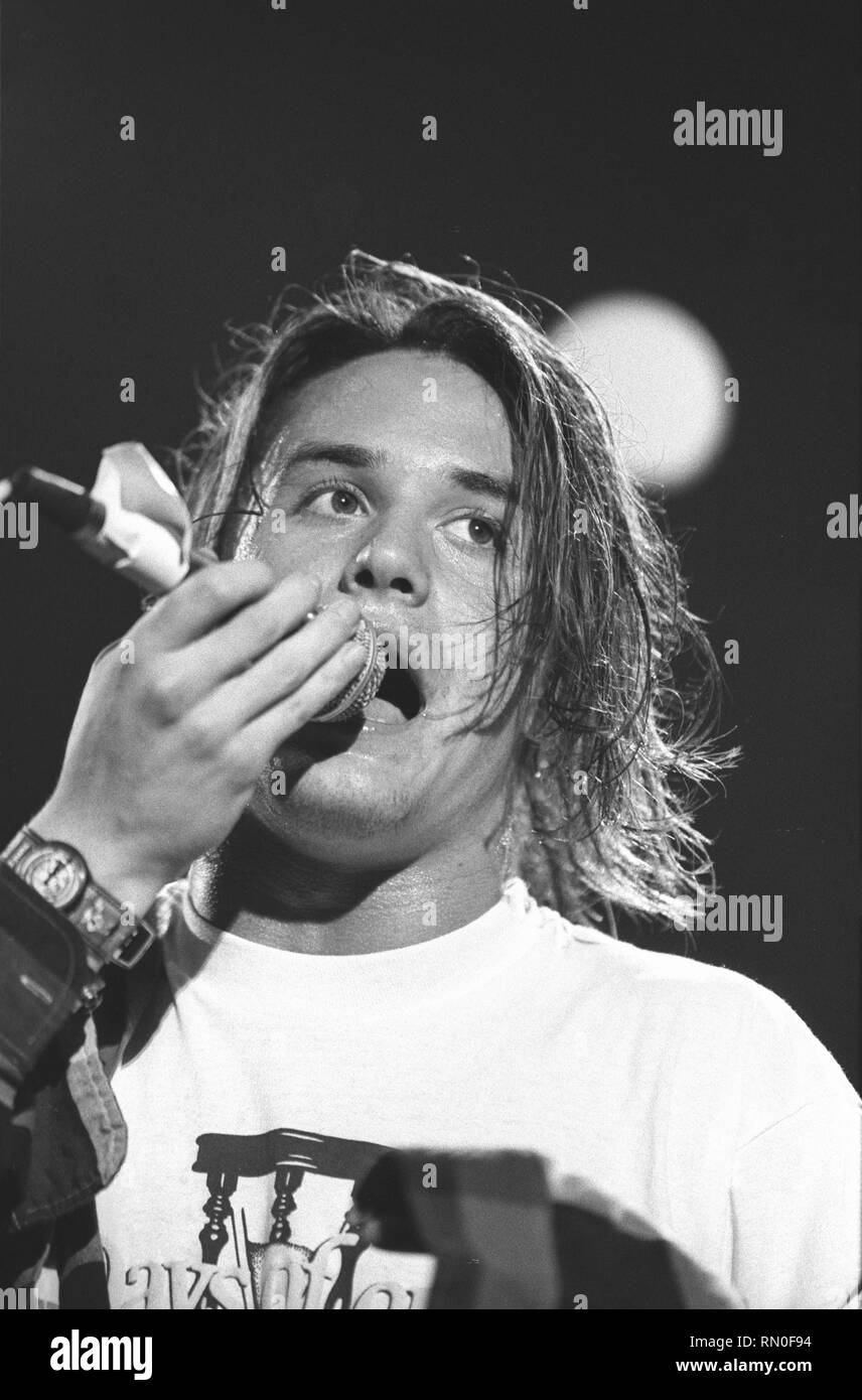 Singer Mike Patton of the alternative rock band Faith No More is shown performing on stage during a 'live' concert appearance. Stock Photo
