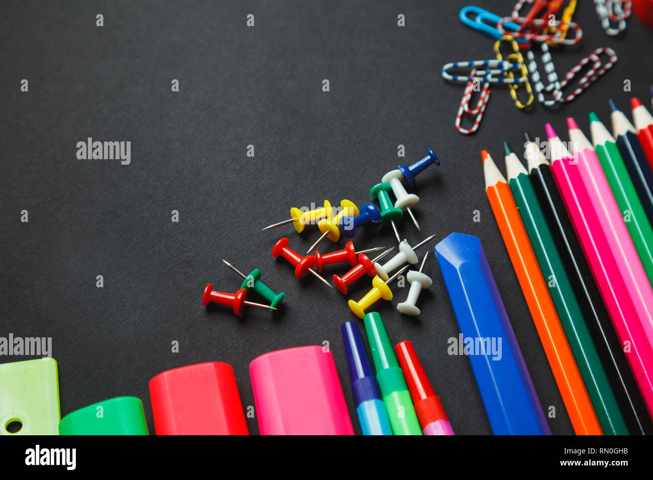 Stationery on dark background top view. back to school Stock Photo - Alamy