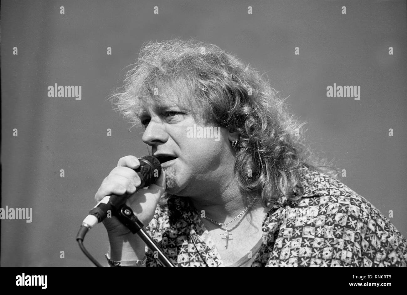 Vocalist Lou Gramm is shown performing on stage during a 'live' concert appearance with Foreigner. Stock Photo