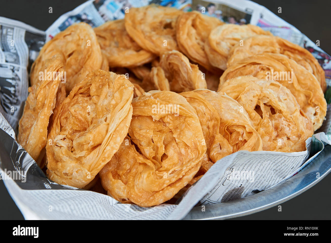 Round flat crispy pastries at an street eatery in Ban Pong, Thailand Stock  Photo - Alamy